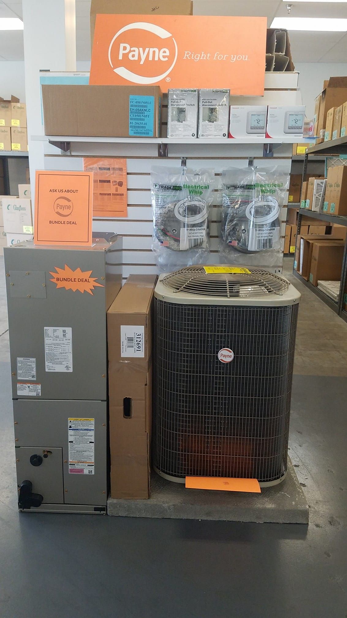 A payne air conditioner is on display in a store