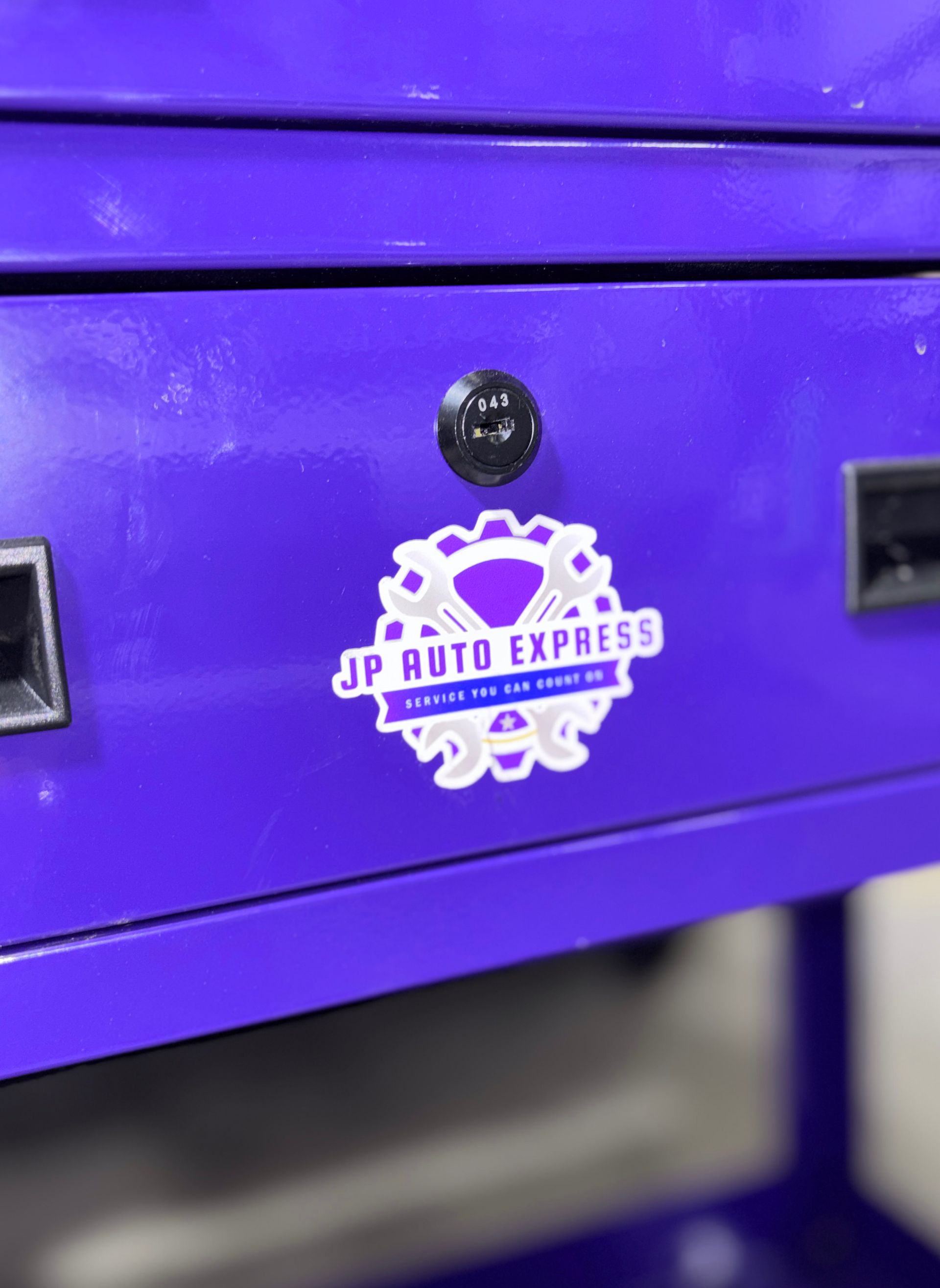 Purple machine panel with a JP Rute Express logo and black fasteners