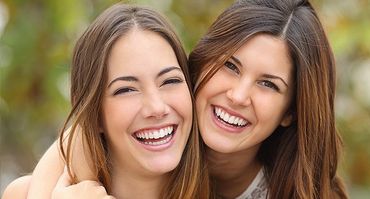 Two women with beautiful smile
