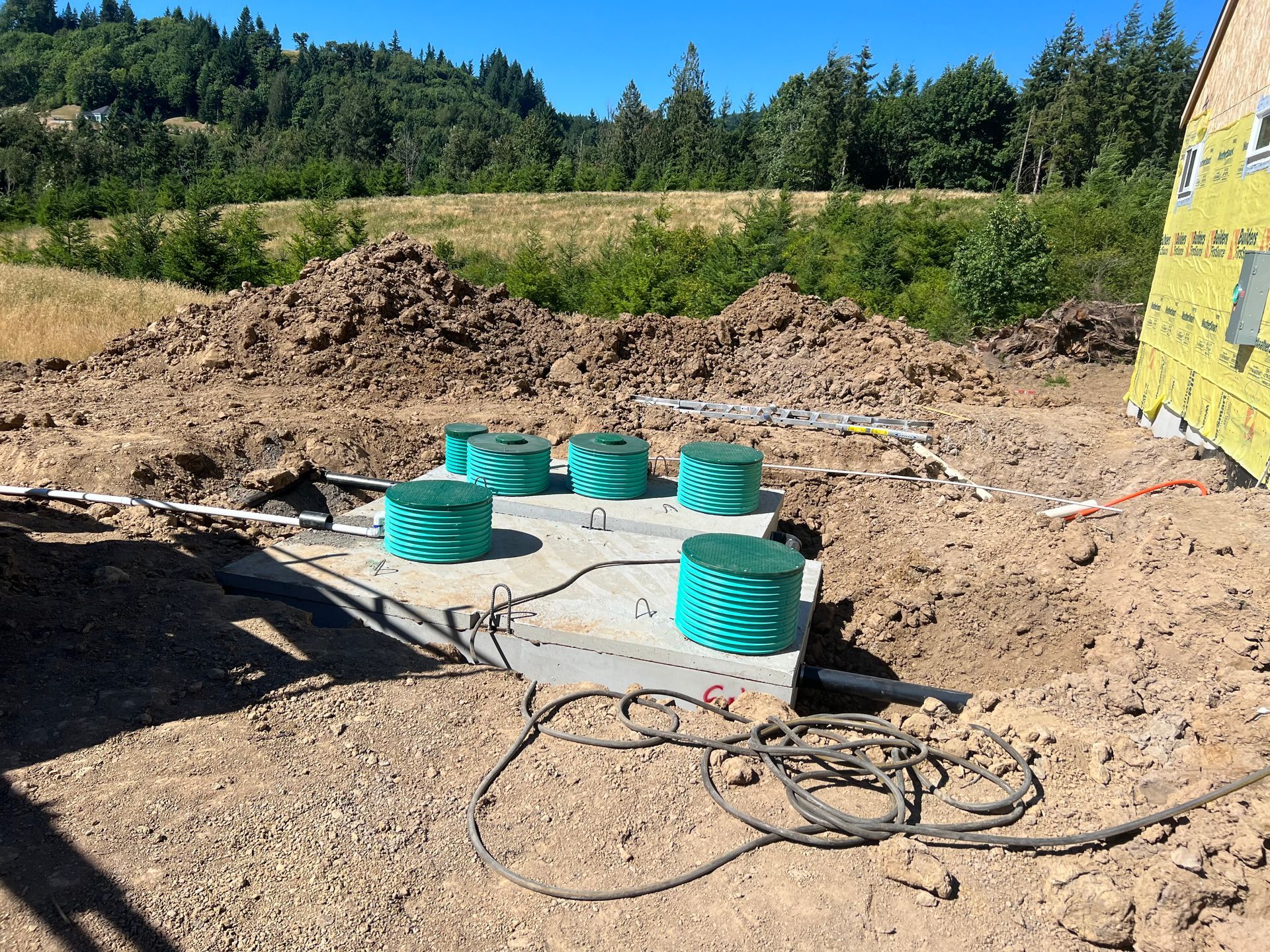 a septic system is being installed in a dirt field