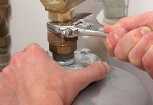 Plumber Repairing a water heater