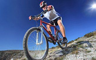 Man riding in a bicycle