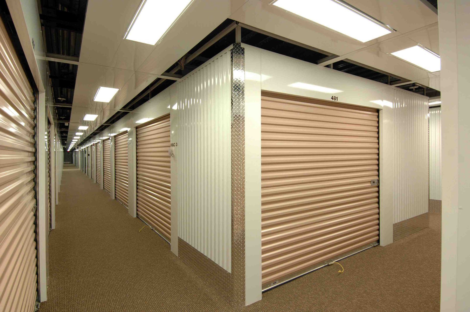 A long hallway with a lot of storage units