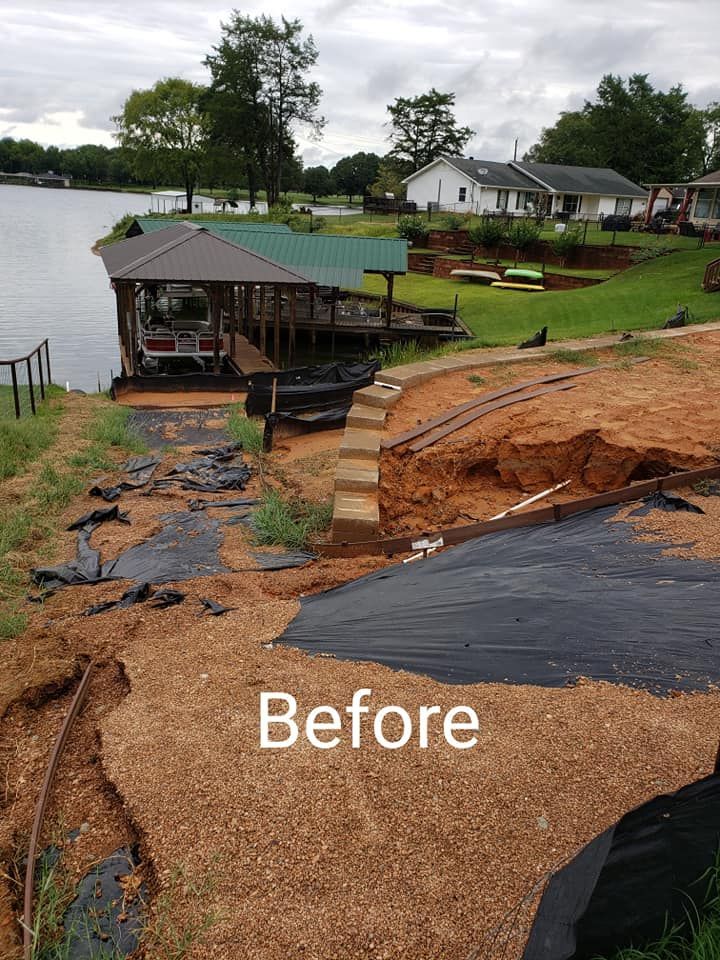 a before picture of a lake with a boat dock
