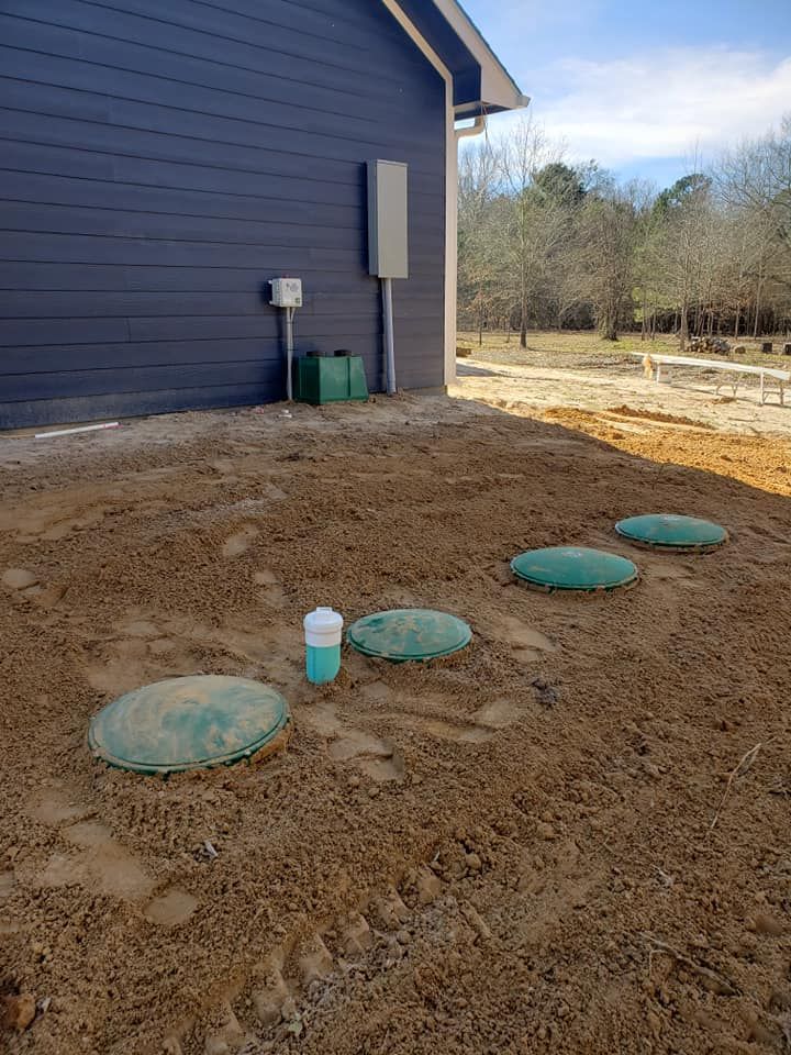 a septic system is being installed in the backyard of a house