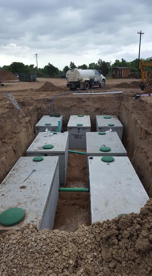 a septic tank is being filled with water by a truck