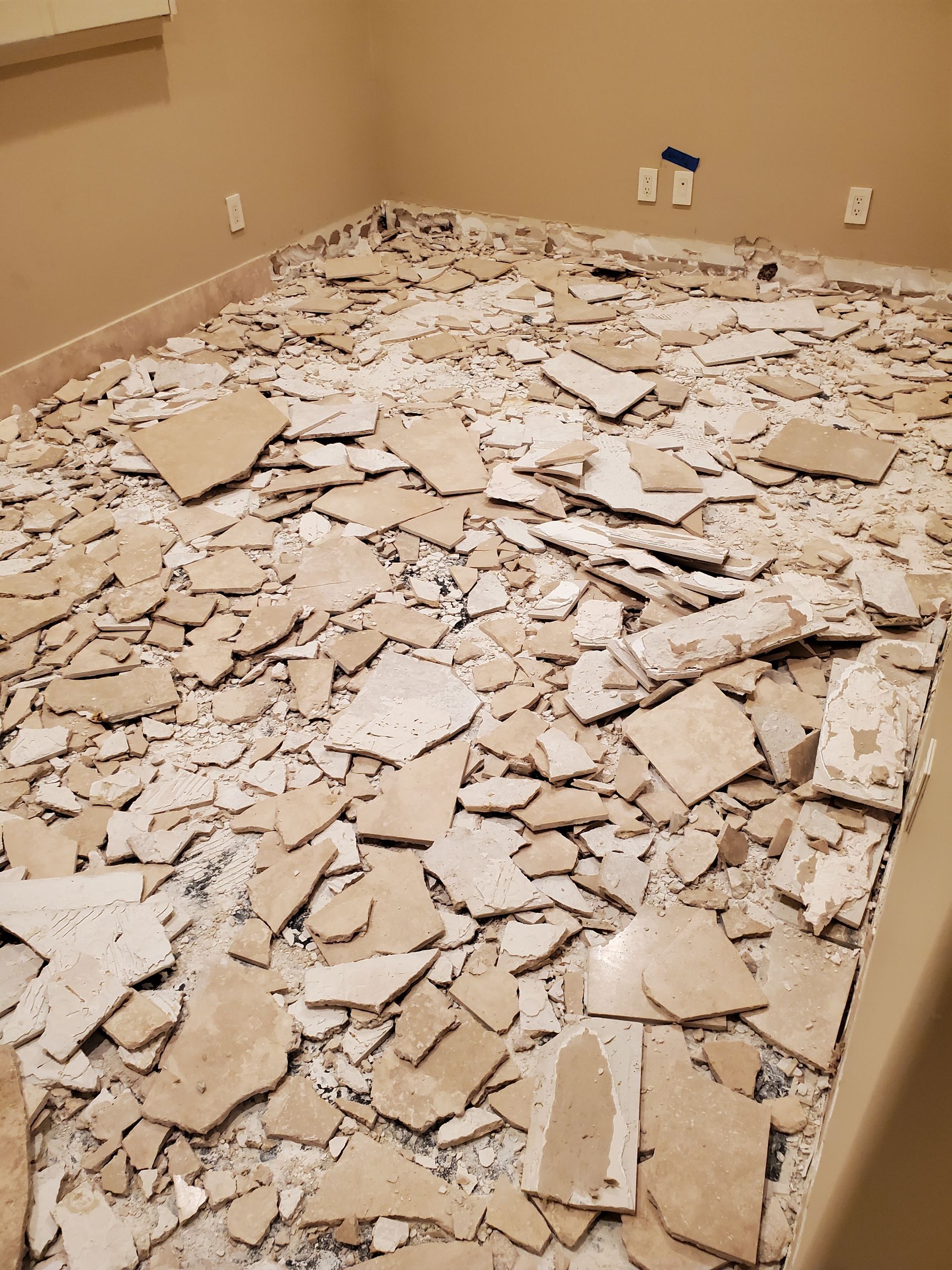 A room with a lot of cardboard on the floor