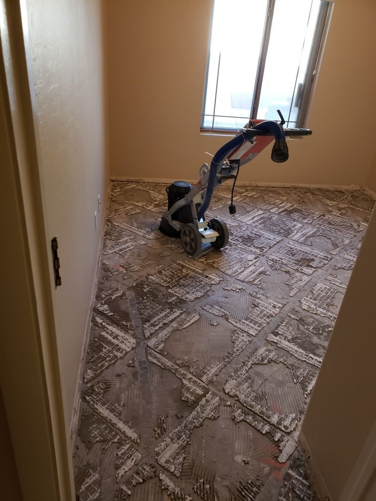 A machine is sitting on the floor of a room.