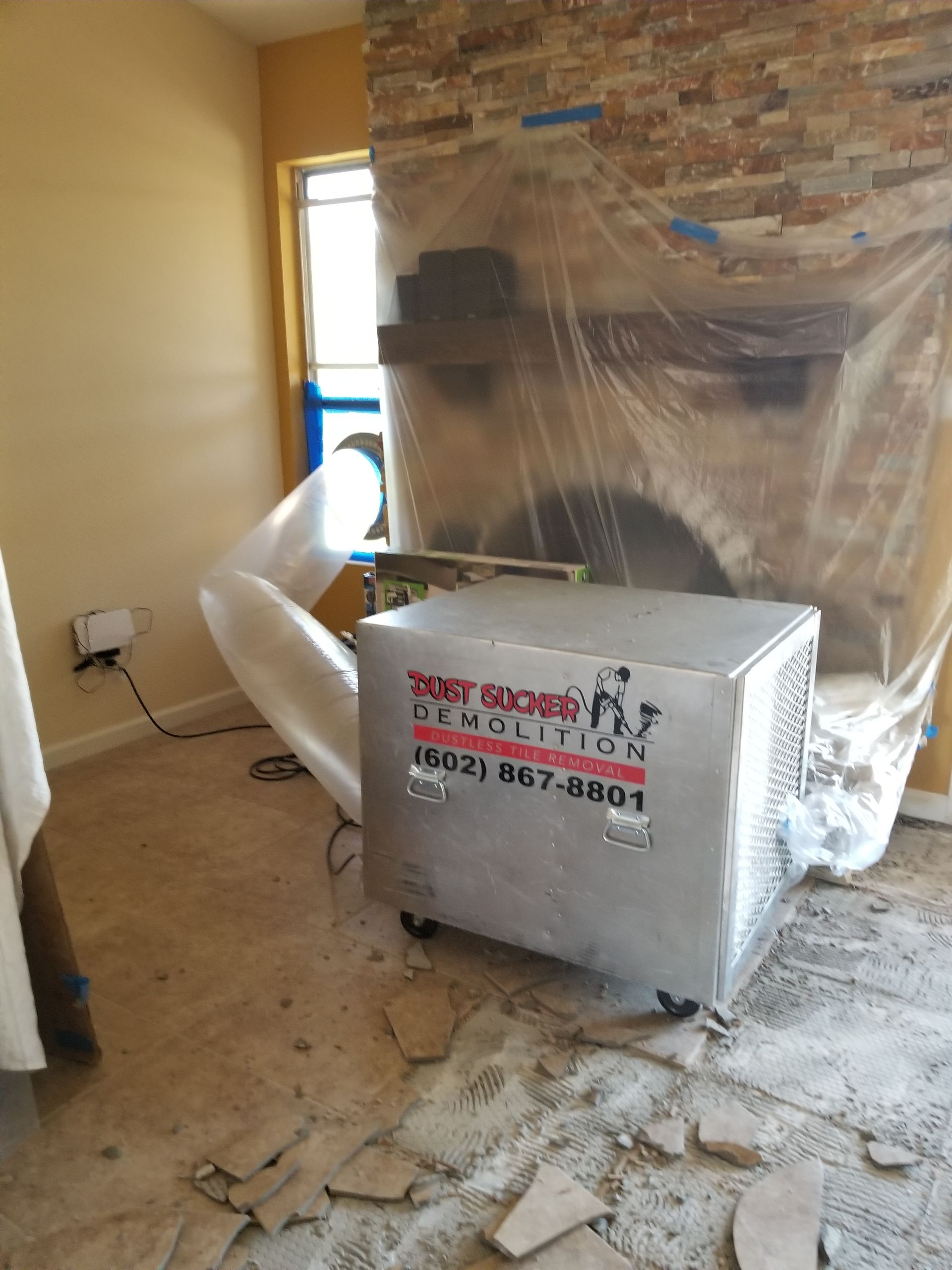 A room with a fireplace and a box on the floor.