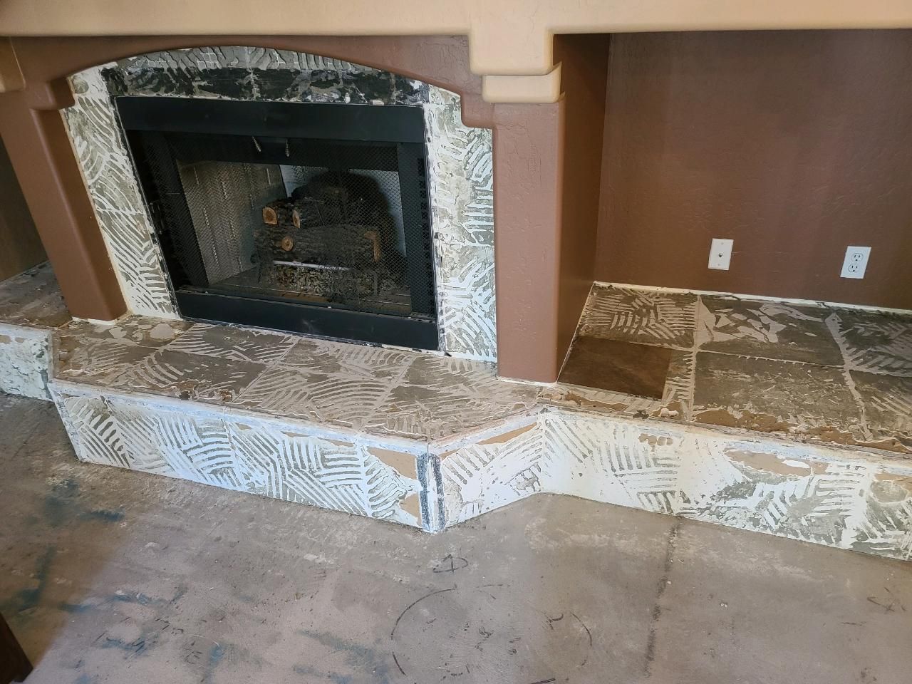 There is a fireplace in the middle of the room.