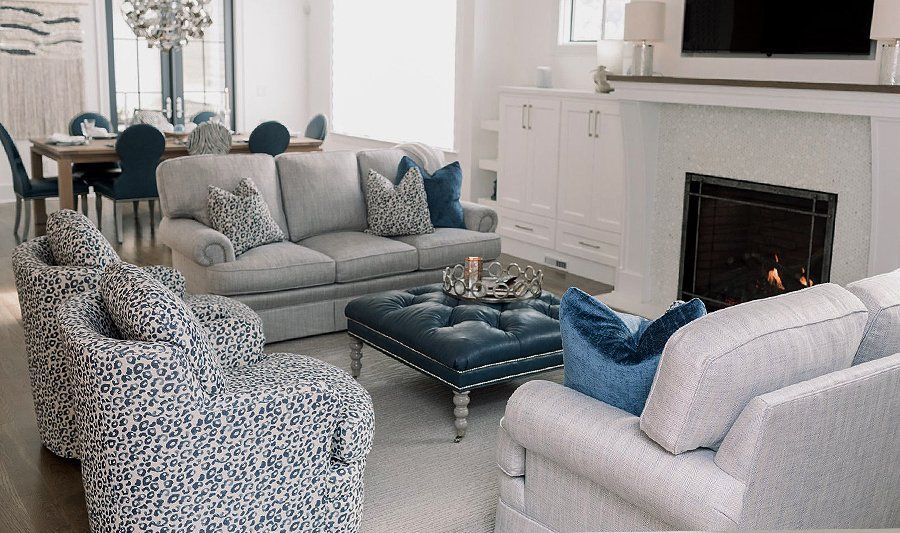 A living room filled with furniture and a fireplace
