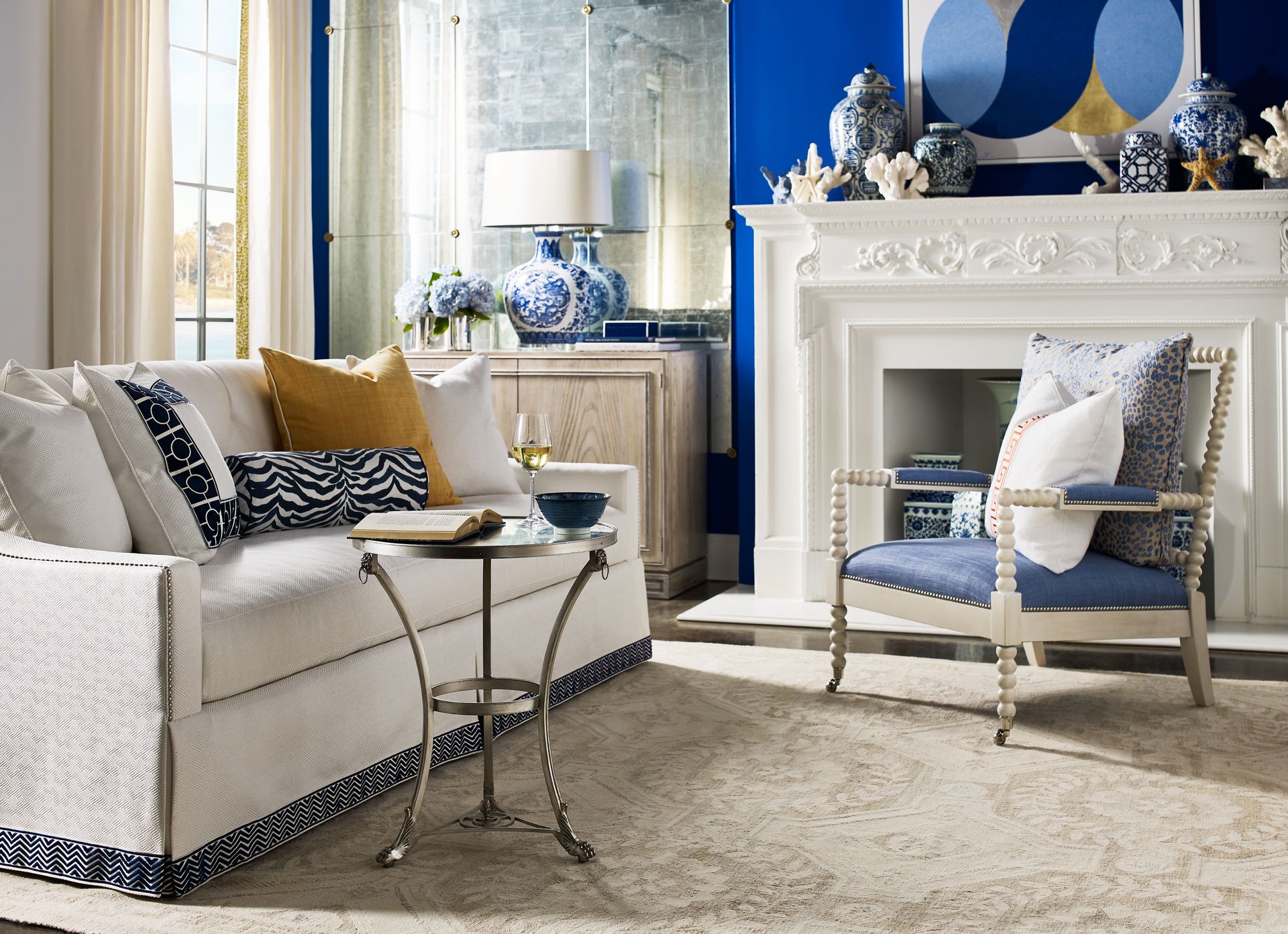 A living room with a couch a chair and a fireplace