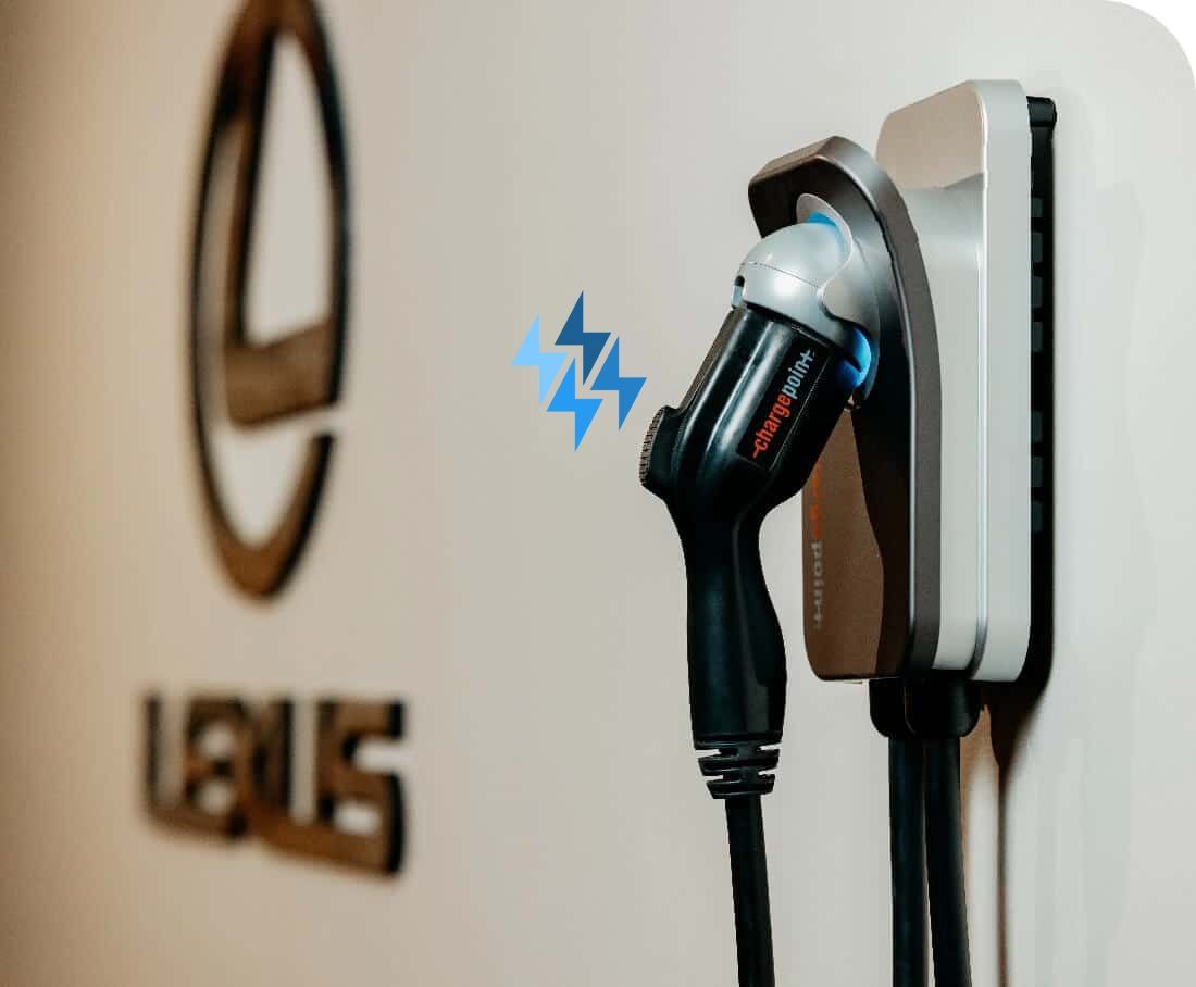 a person is charging an electric car with a charger