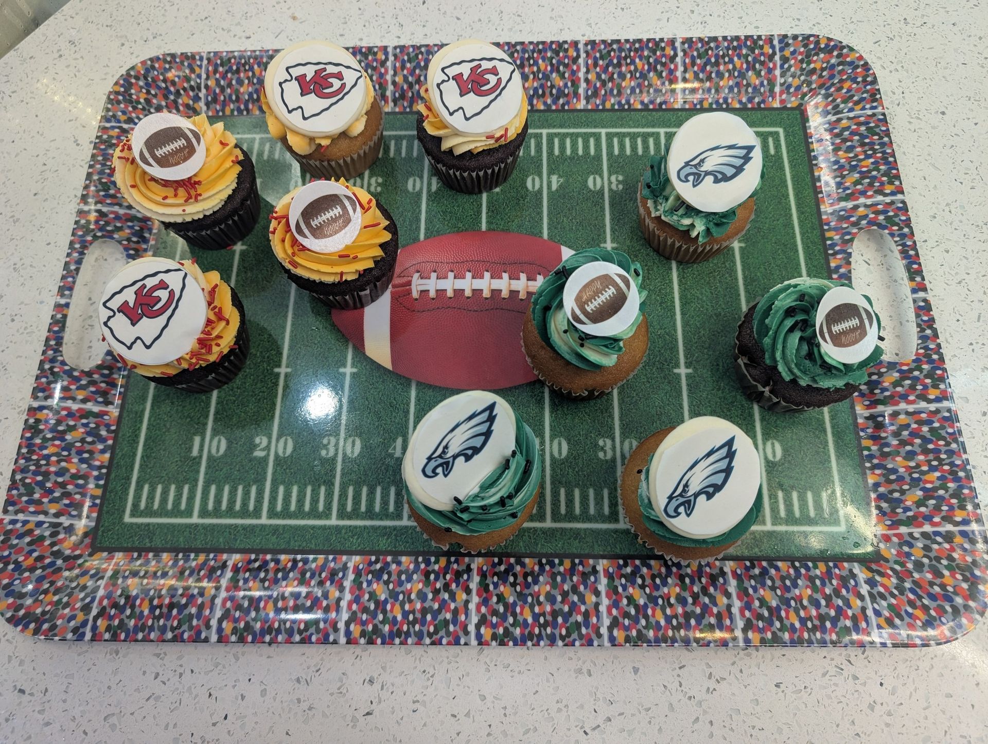 A tray of cupcakes decorated to look like a football field
