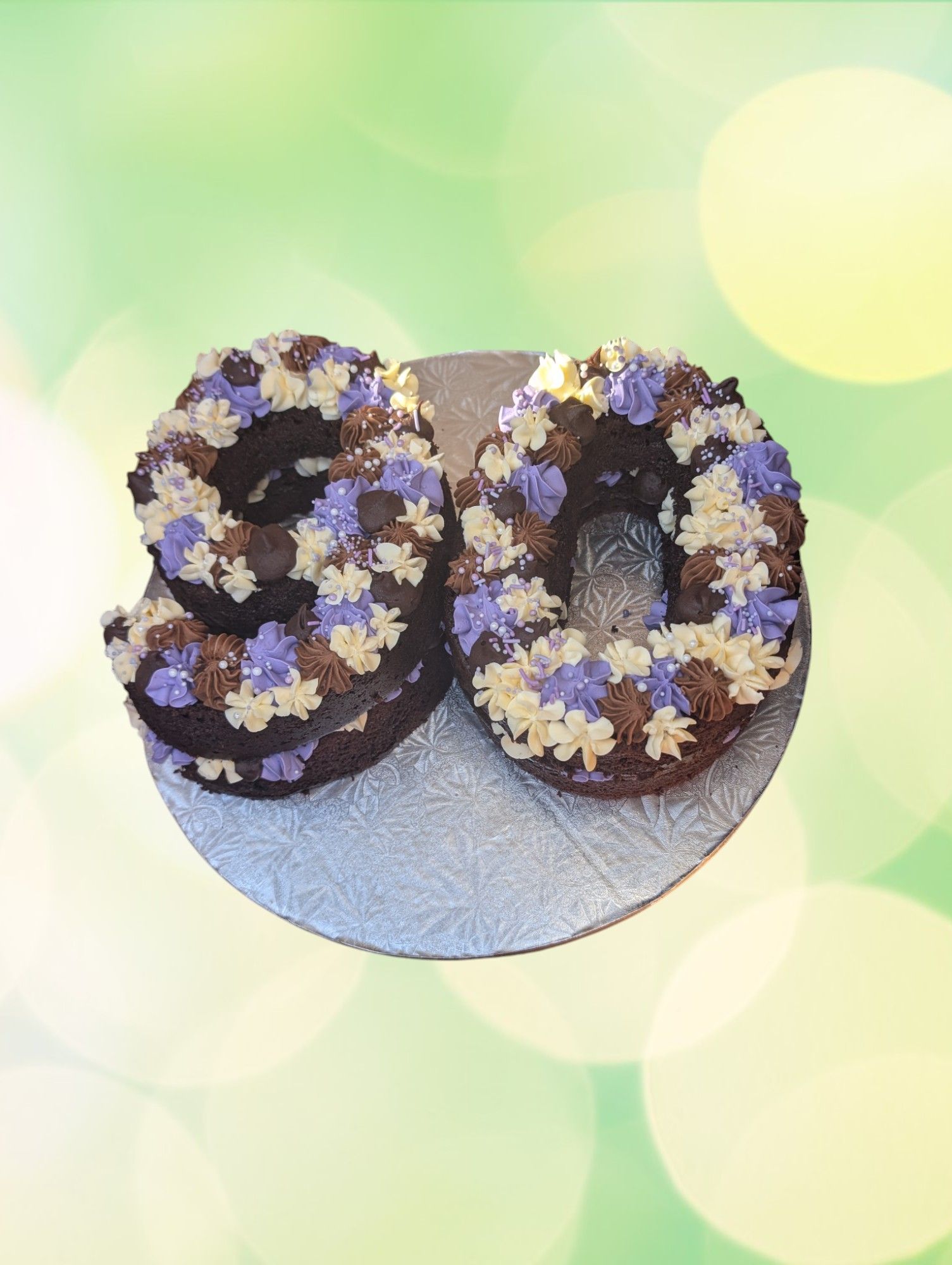 A cake in the shape of the number 30 is on a plate.