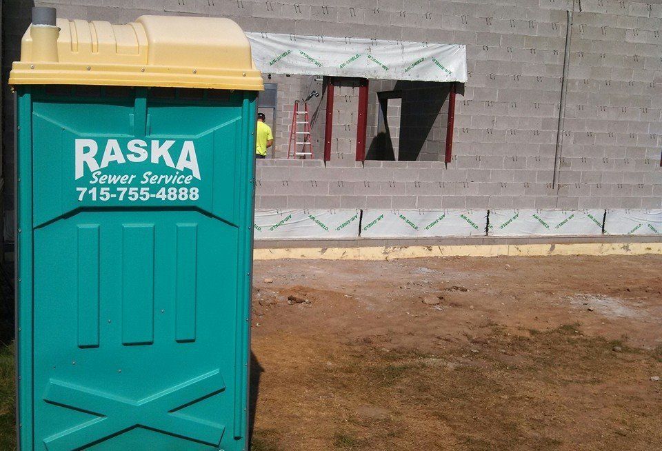 teal colored portable toilet