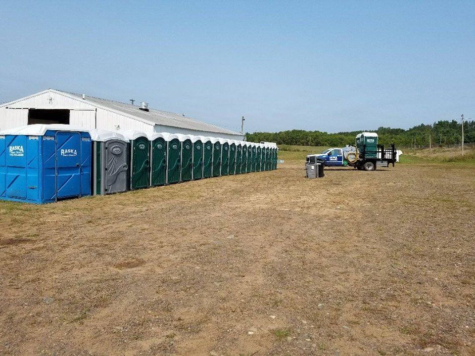 lined up portable toilets outdoor