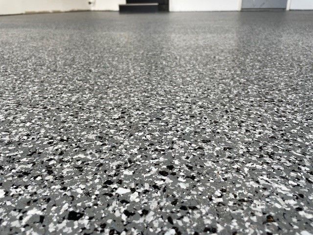 Gray speckled epoxy garage floor.