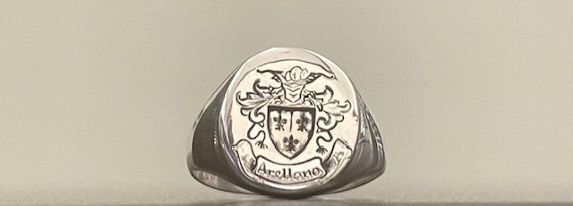 Silver signet ring with family crest and name 