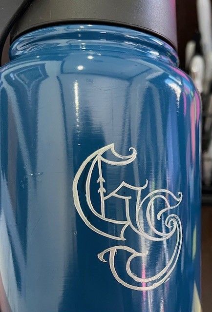 Blue water bottle with white monogram 