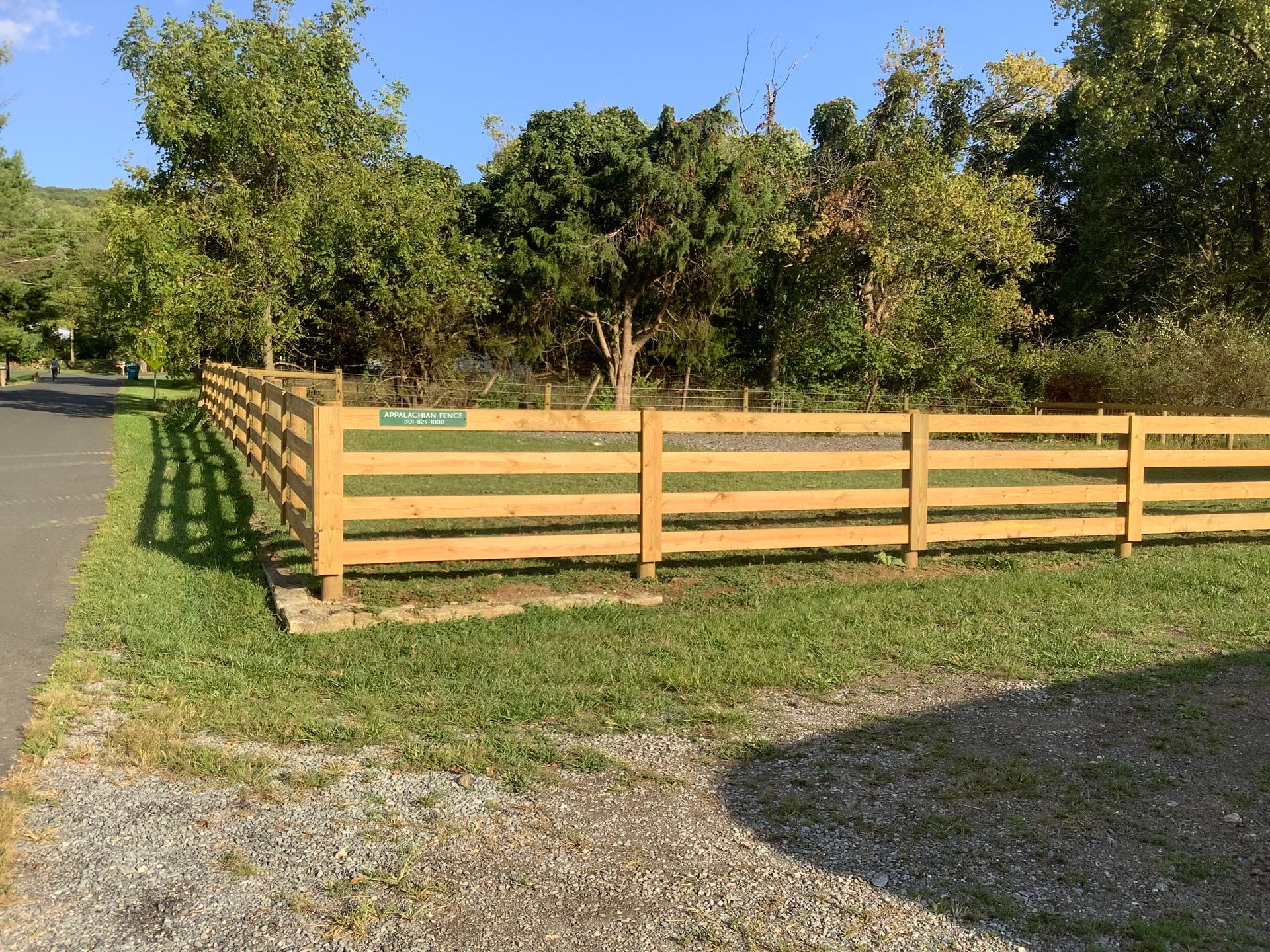 light brown wooden fence installed by agricultural fencing companies near me