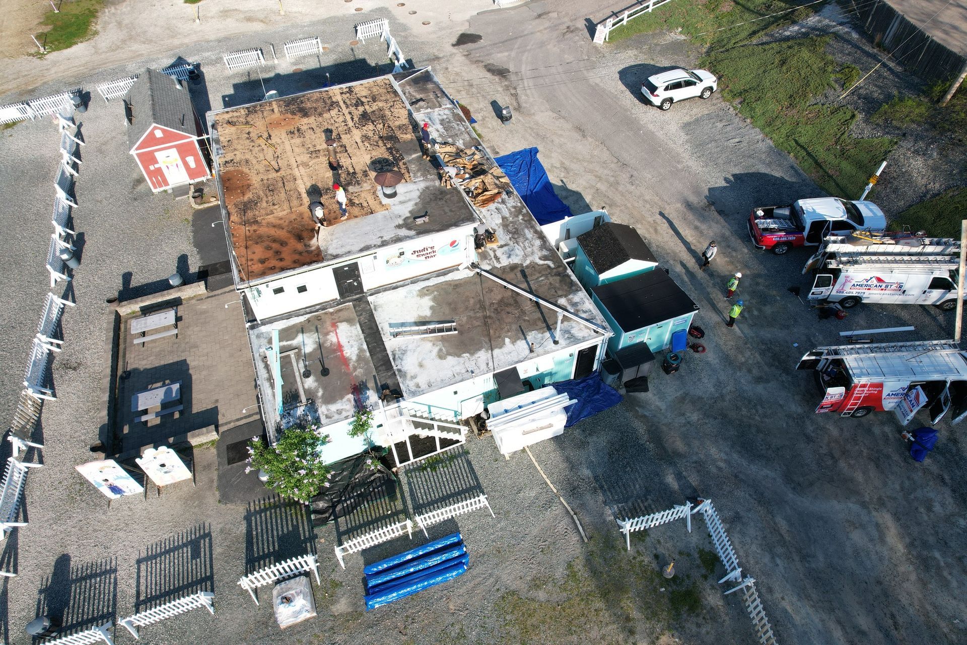 An aerial view of a building with a stop sign on the roof.