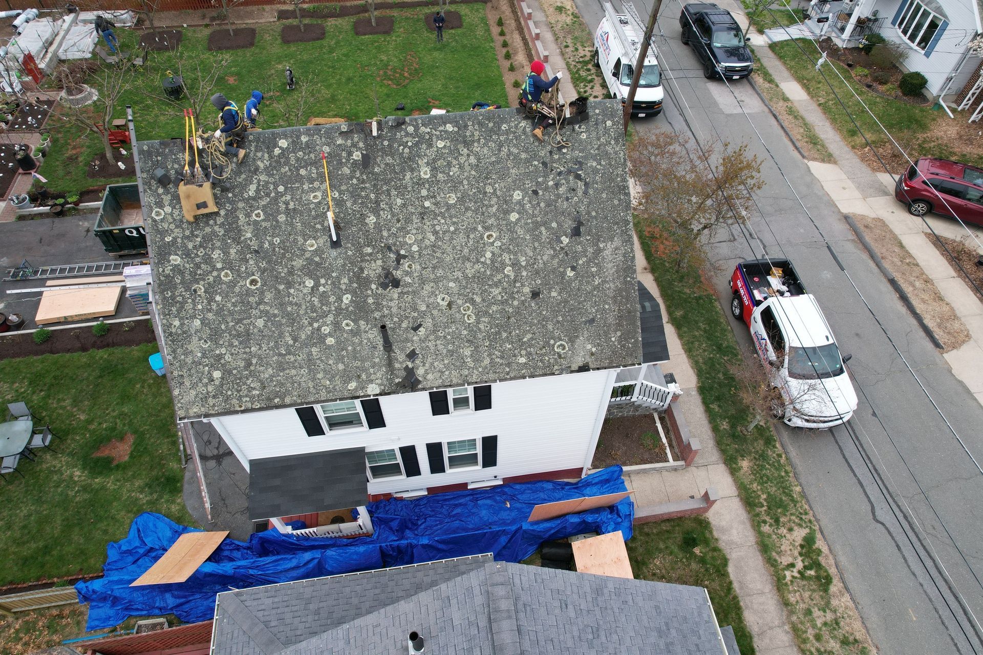 An aerial view of a roof being installed on a house.