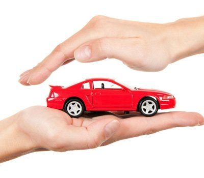 Red car in hands