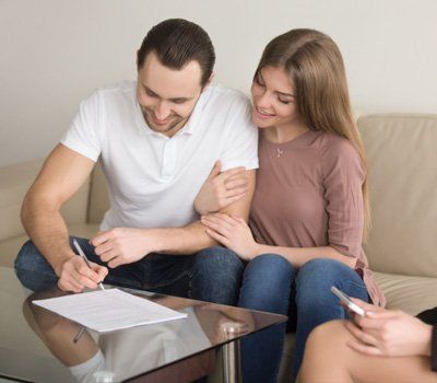 Renters signing Insurance documents