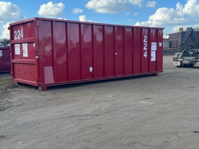 Red dumpster labeled 
