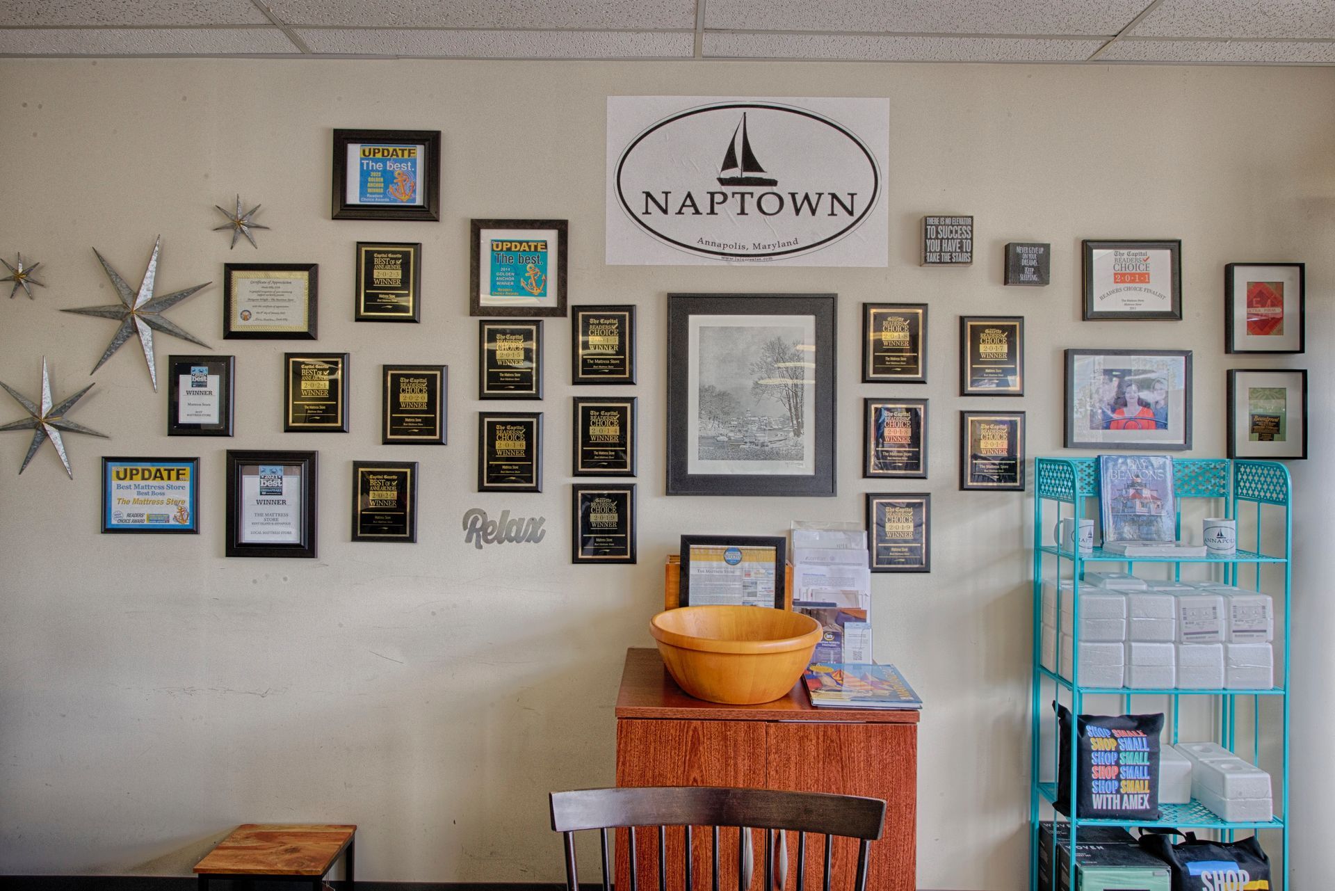 Wall with framed awards and 