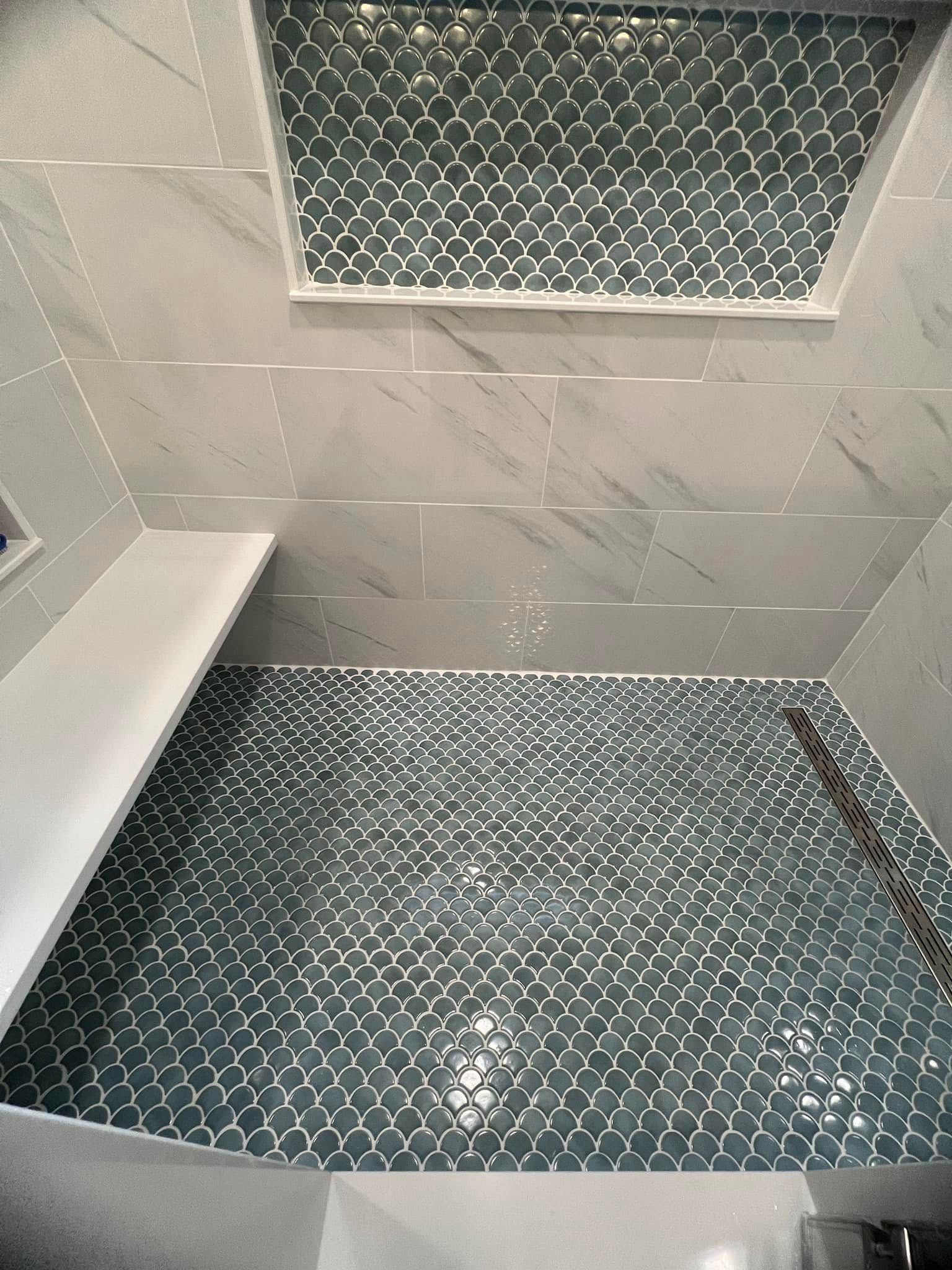 An aerial view of a bathroom with a tiled floor and ceiling.