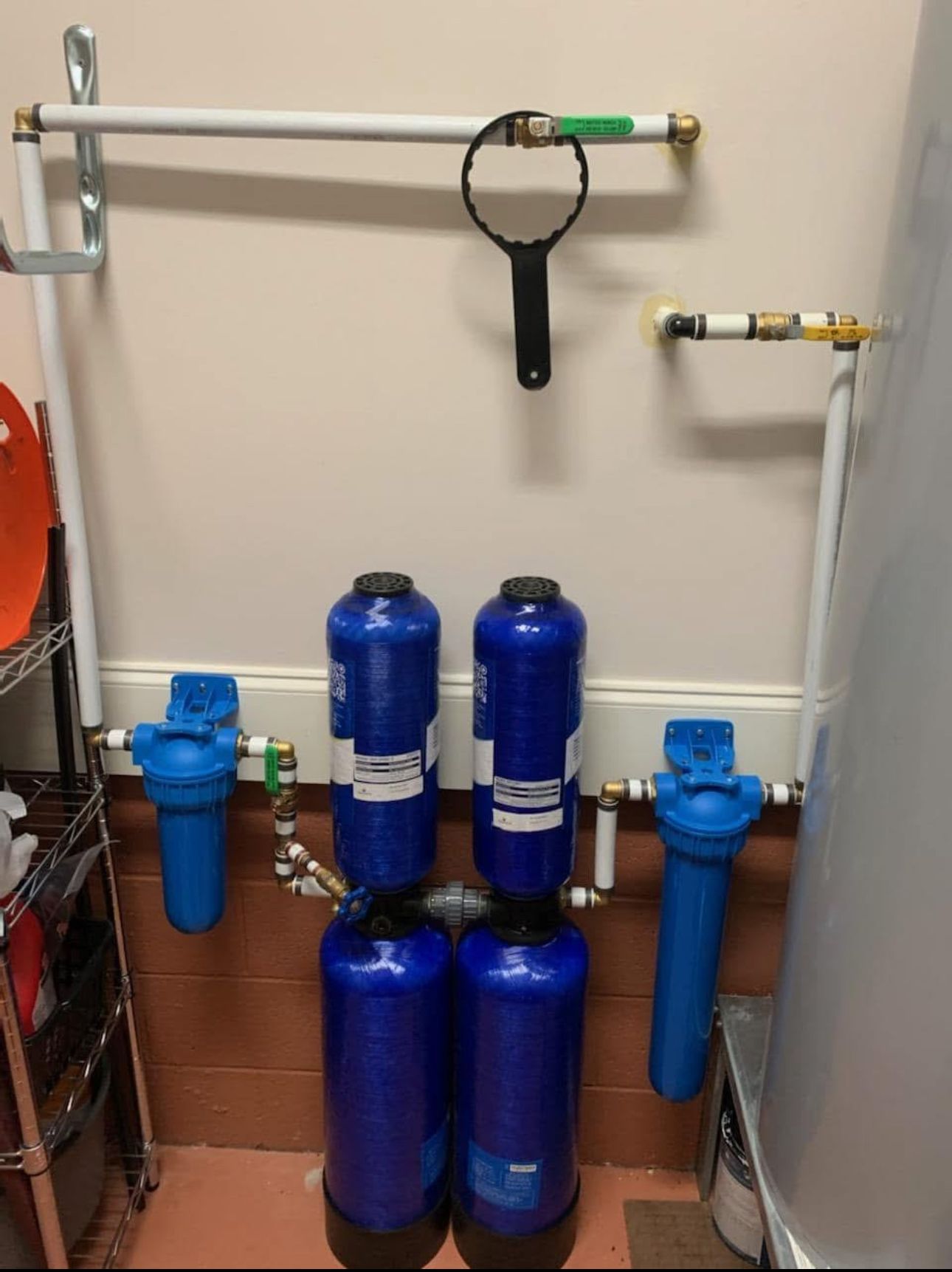 Two blue bottles are sitting next to each other in a room