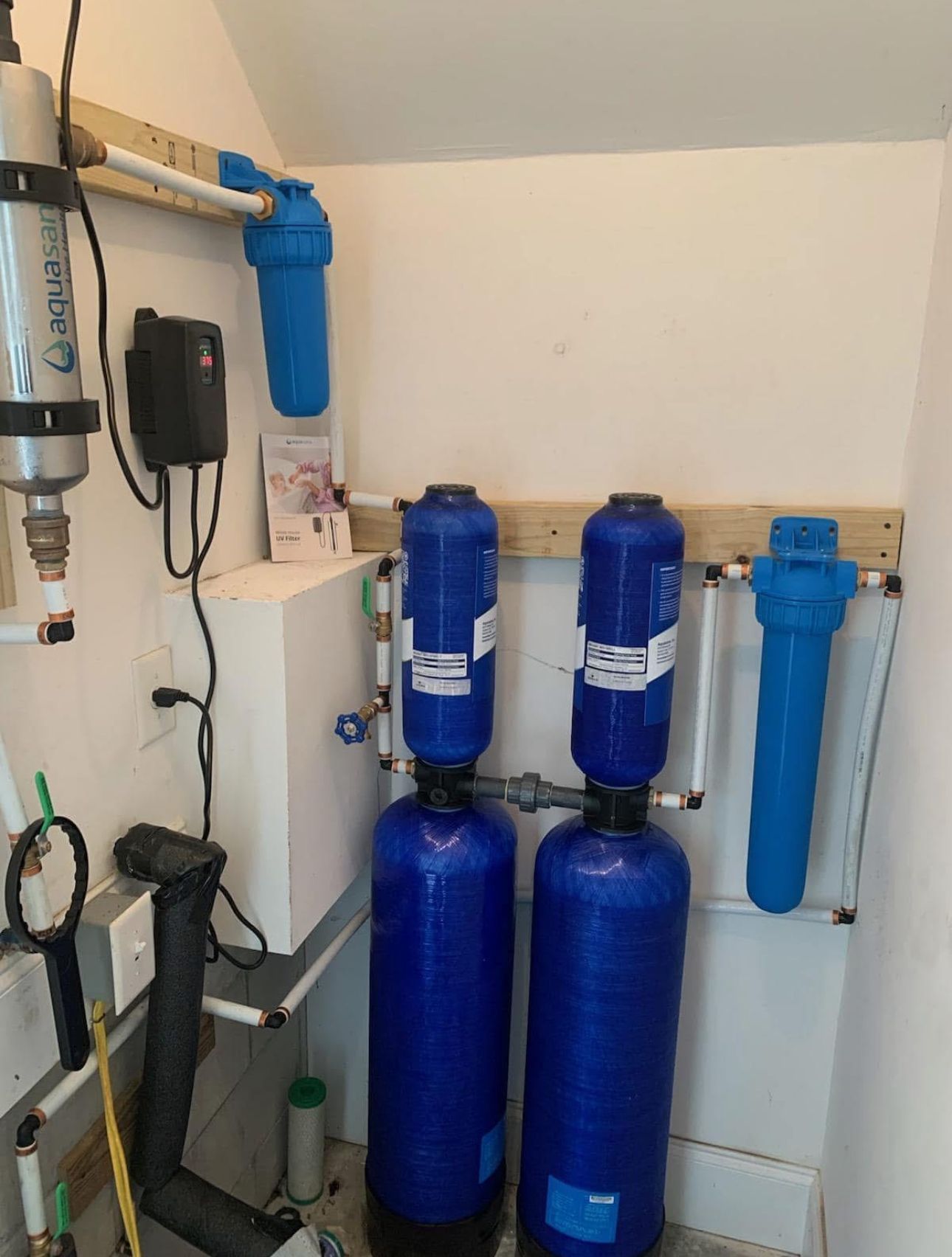 Two blue tanks are sitting in a room next to each other