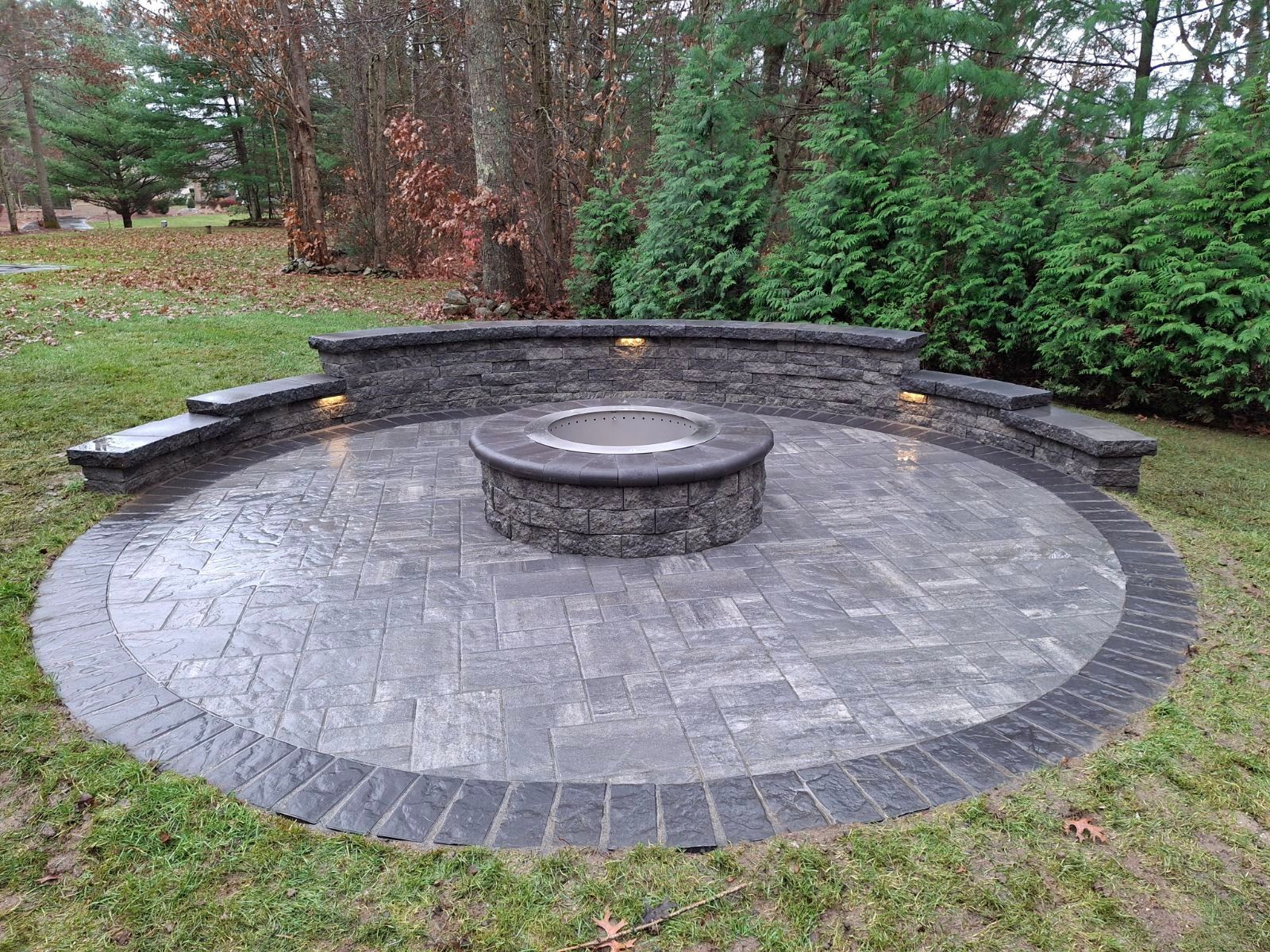 A fire pit in the middle of the patio.