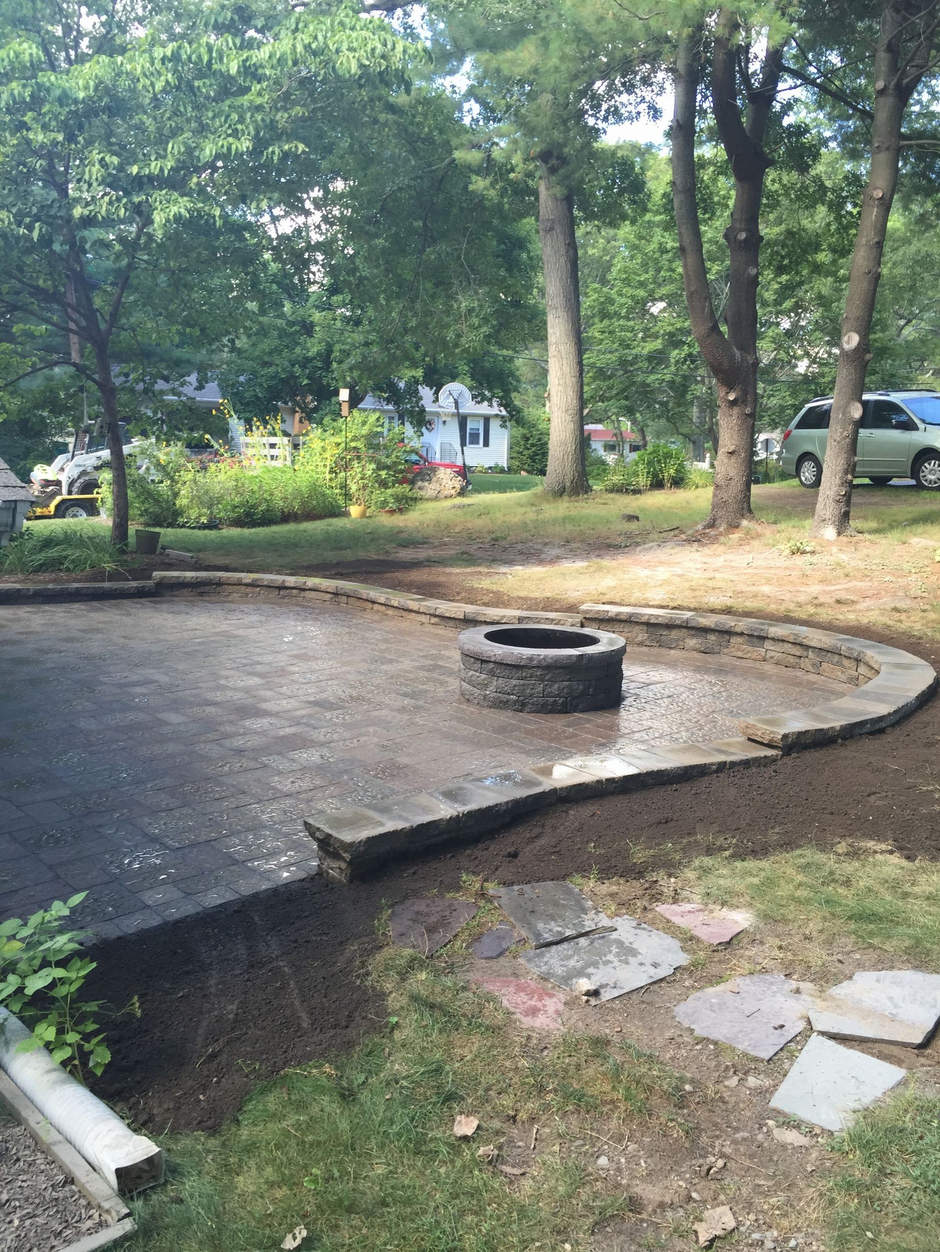 There is a fire pit in the middle of the yard.