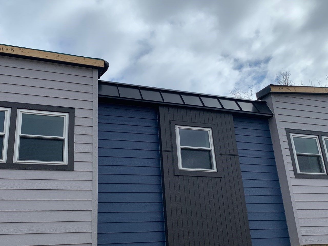 A blue and white building with a lot of windows