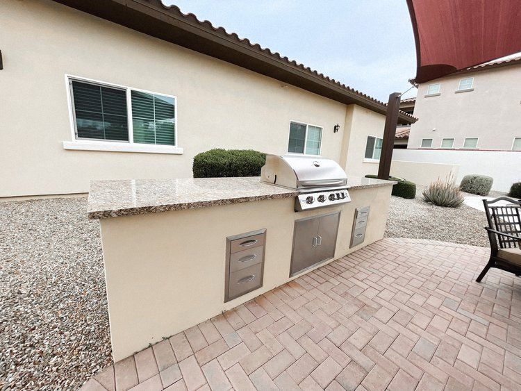 A house with a grill on the side of it