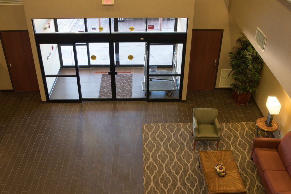 An aerial view of a lobby with a couch and chairs
