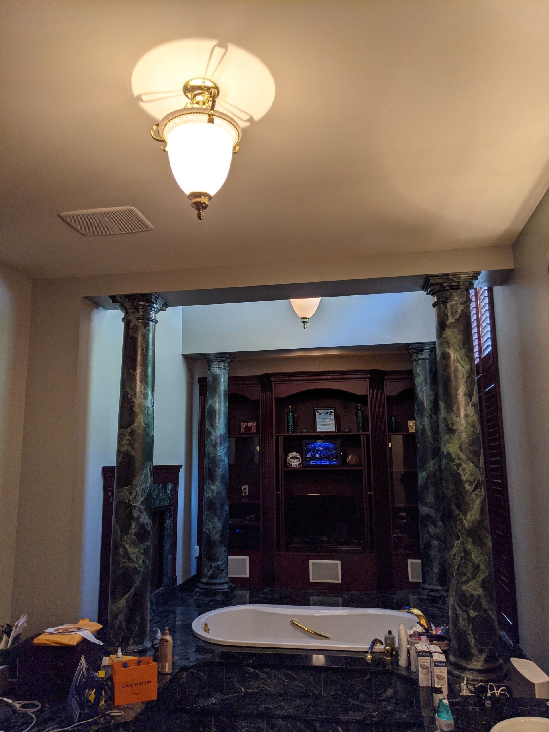 Bathtub next to a shelve