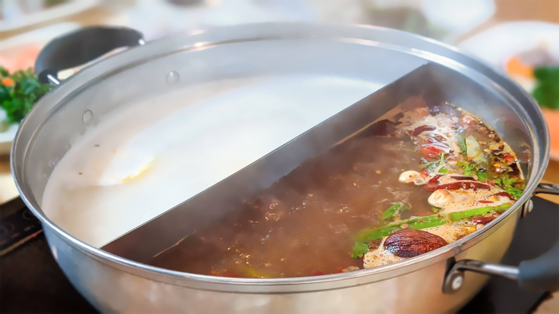 a pot of hot pot is being cooked on a stove