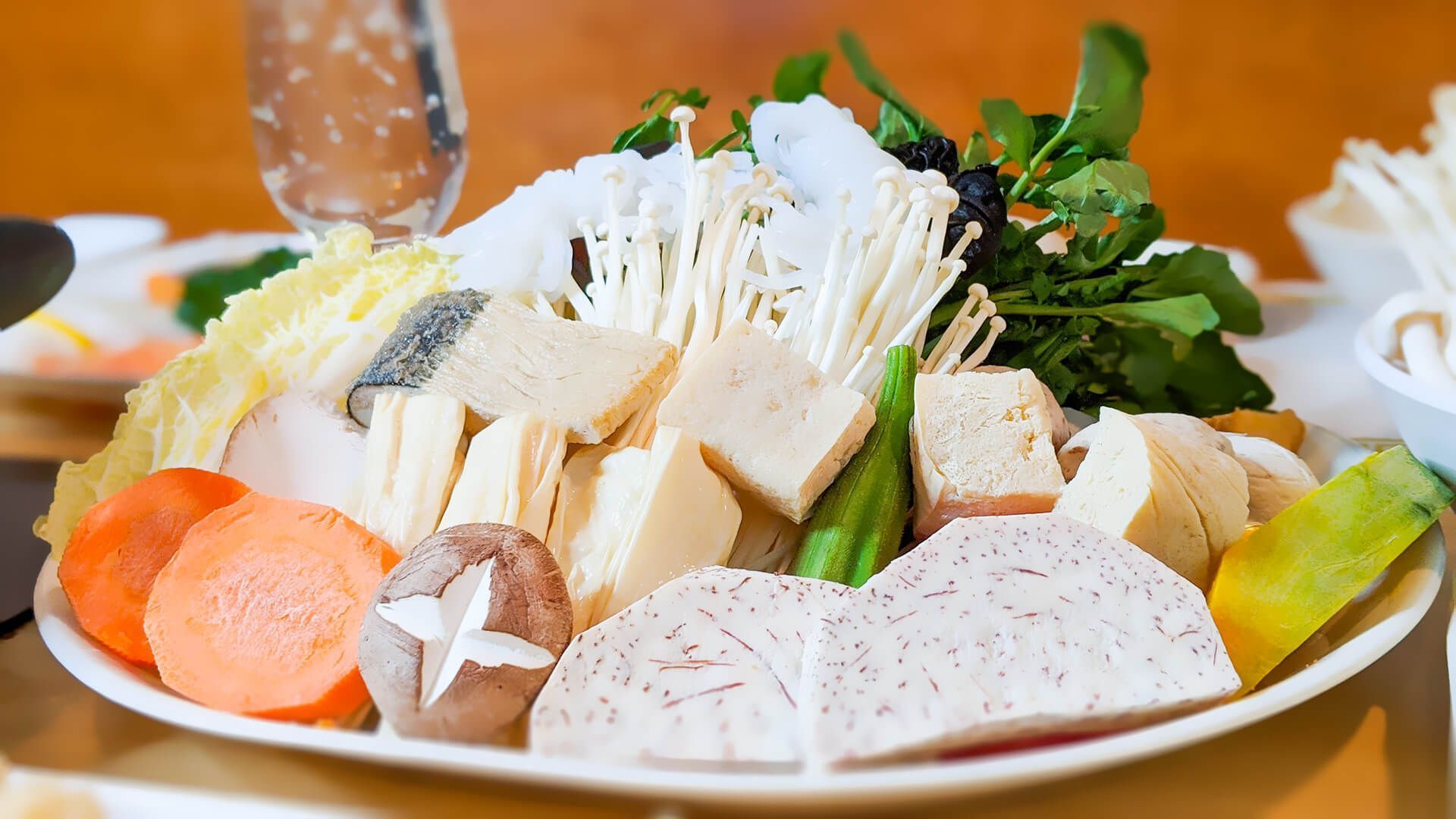 a plate of food with vegetables and meat on a table
