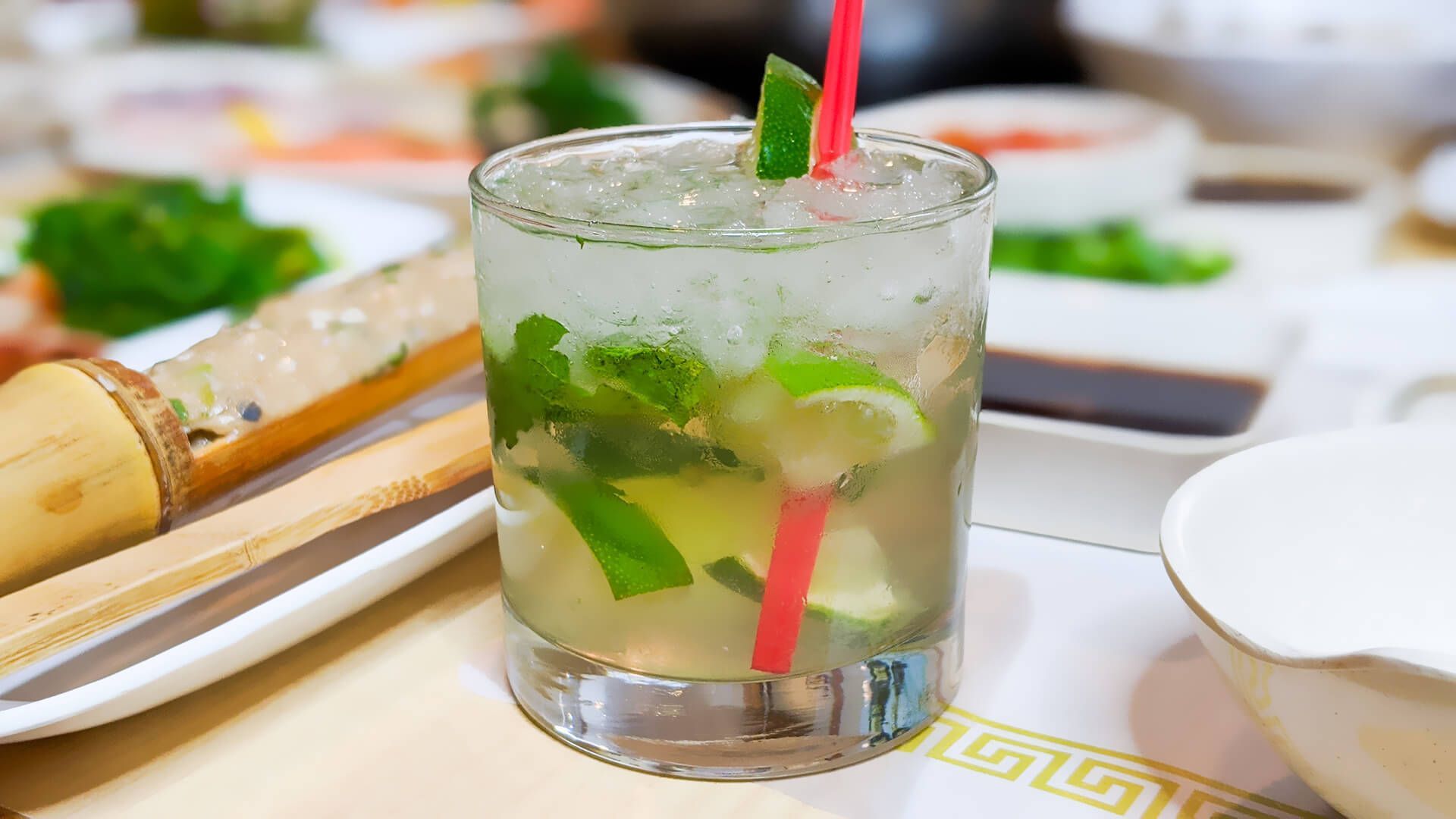 a drink with a straw in it is on a table