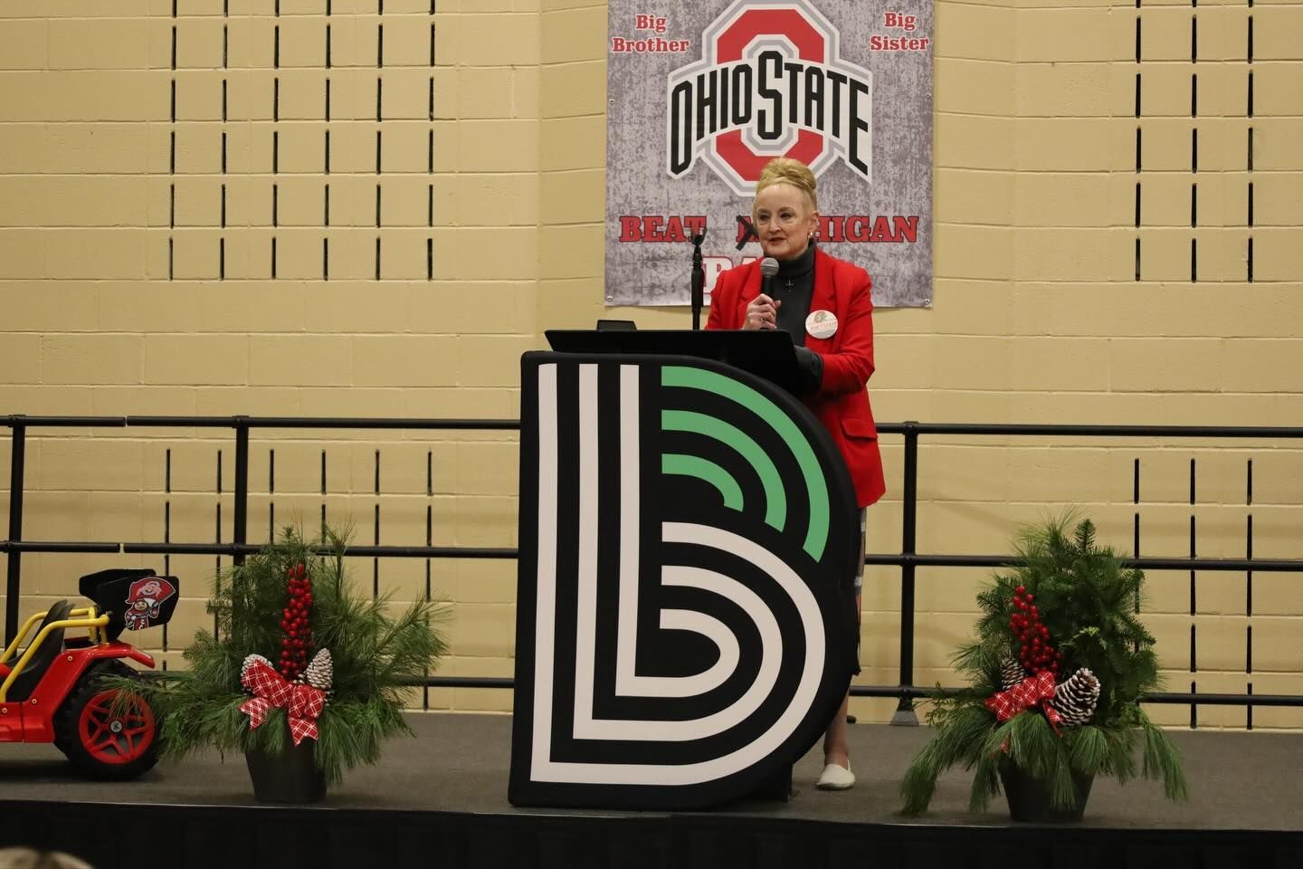 Woman speaking at a podium.