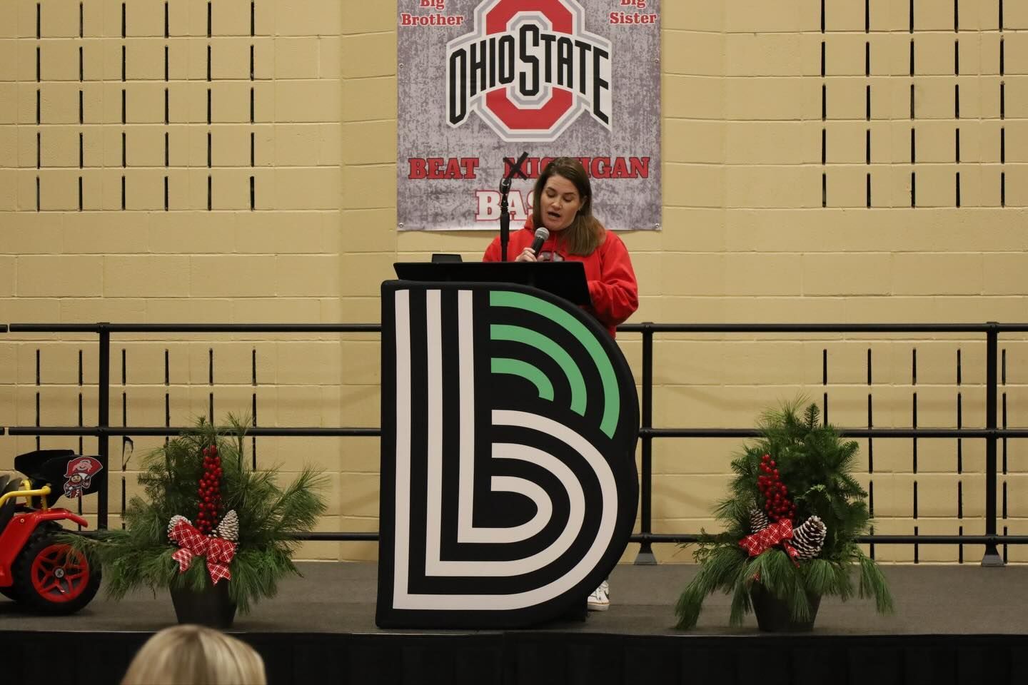 A woman speaking on the stage.