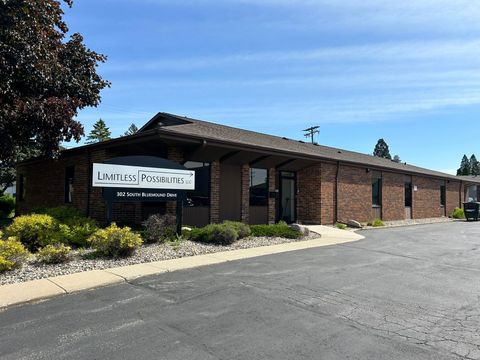 Exterior of a brick building with a sign that reads 