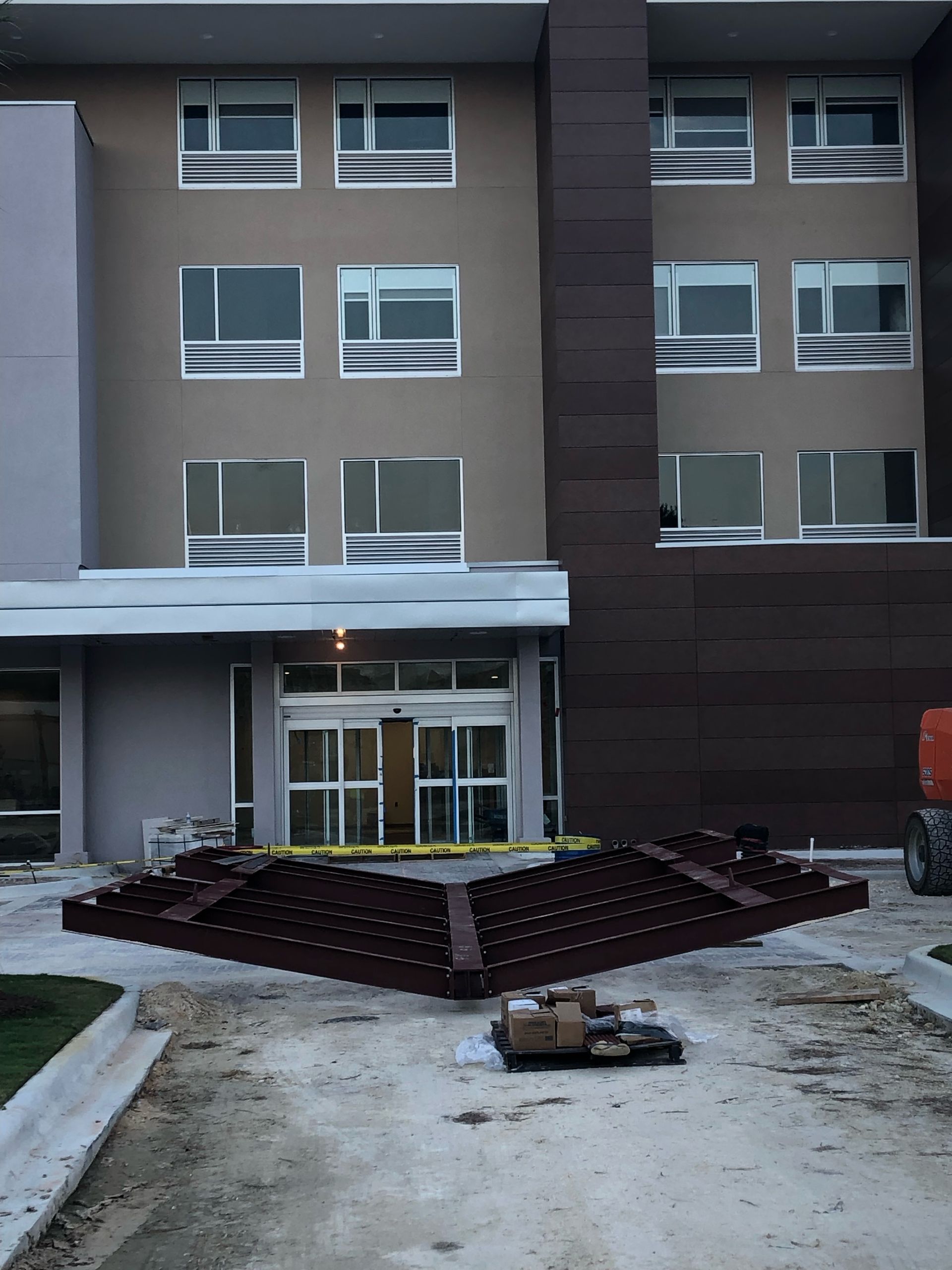 A large building with a lot of windows is under construction