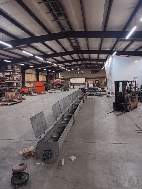 A large warehouse with a forklift in it