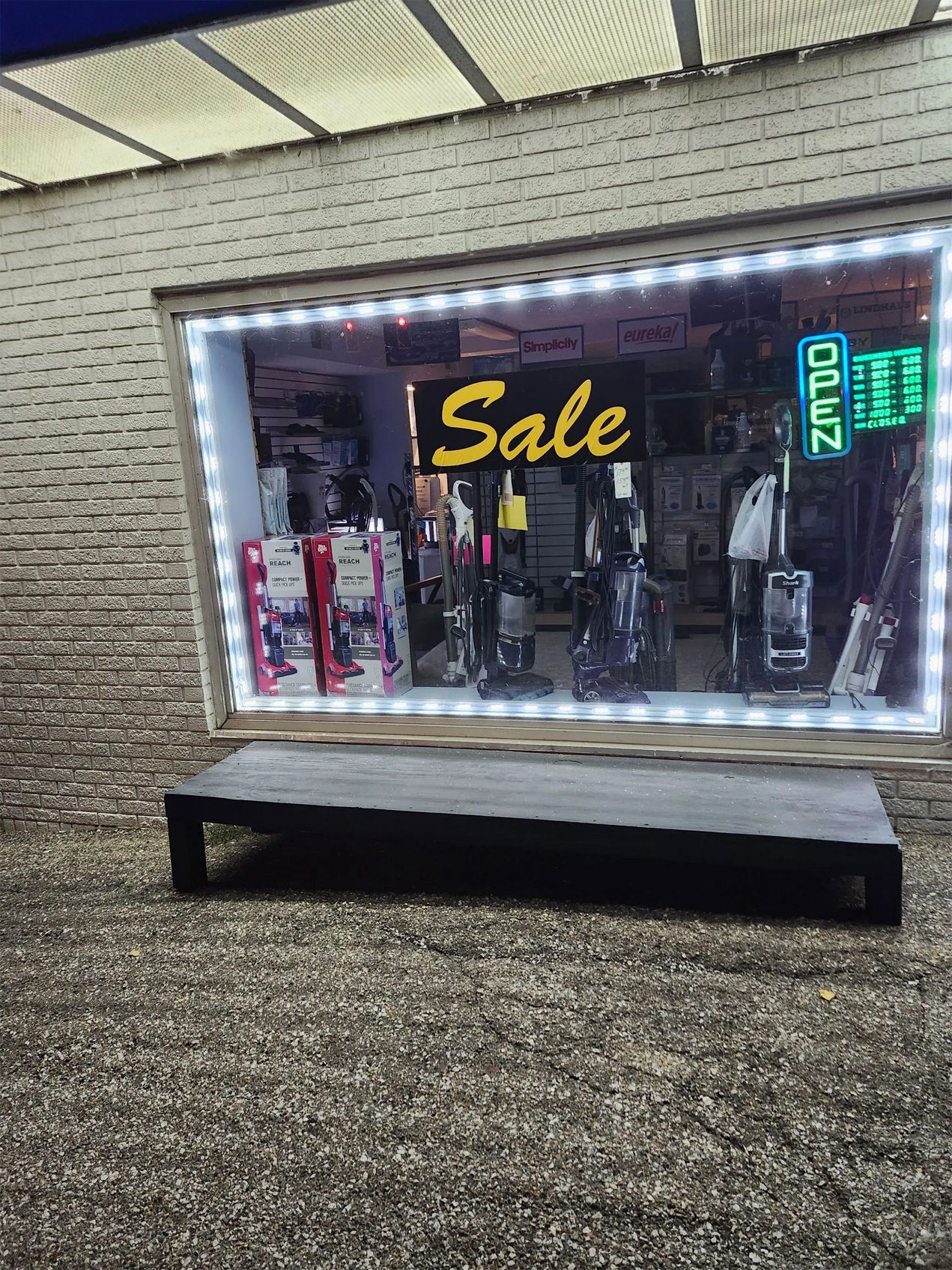 Storefront display with assorted goods in a window