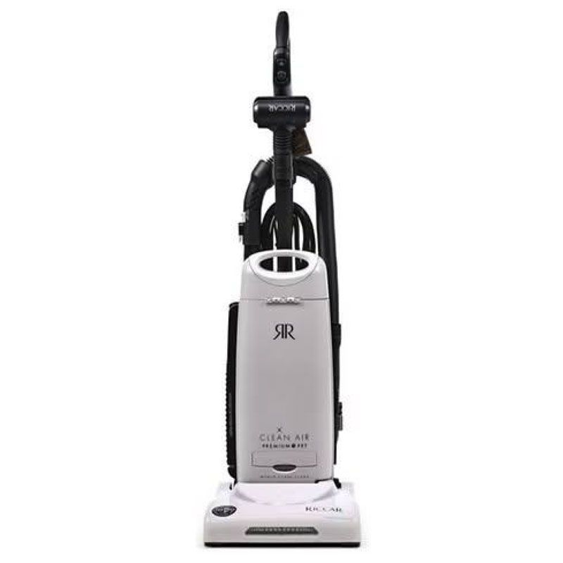 Upright white and black vacuum cleaner on a white background